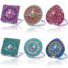 Conjunto de anillos Punto De Diamante con diseños circulares y brillo de piedras en colores vibrantes.