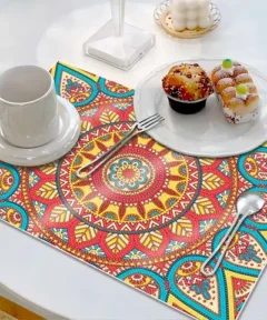 Tapete Antideslizante Mandala Diamond Painting con diseño mandala en colores brillantes sobre una mesa junto a una taza y postres